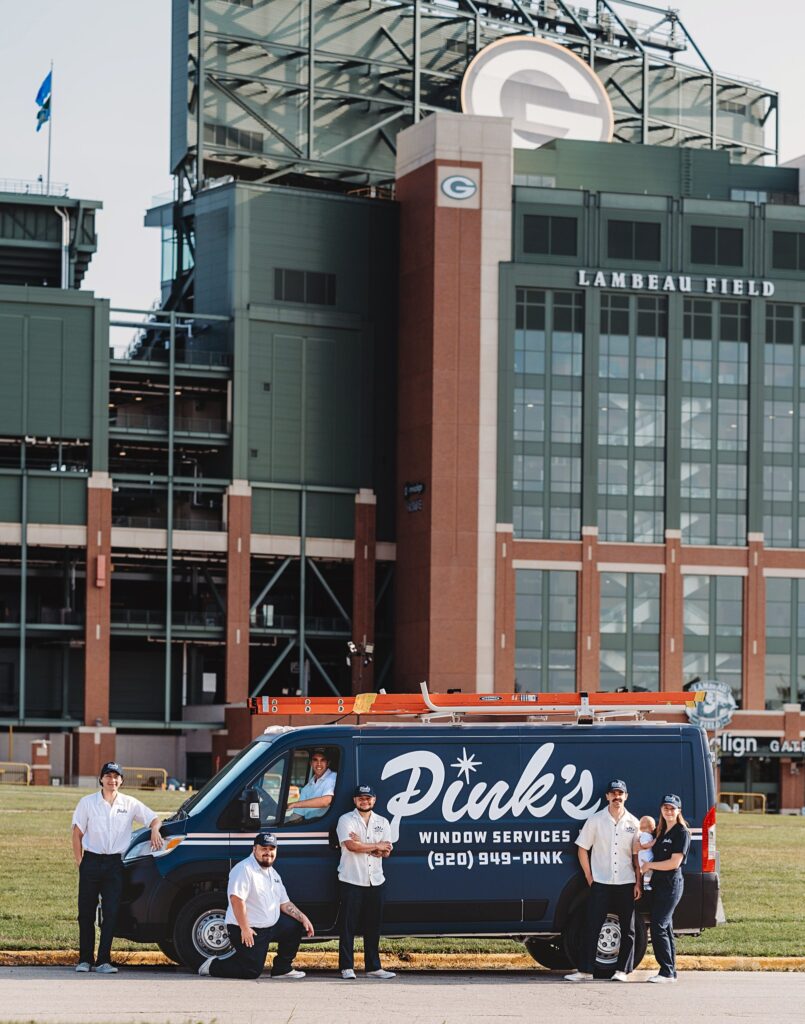 Pink's Windows Green Bay Service van outside Lambeau Field